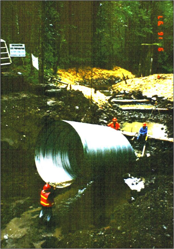 This photo shows the new culvert and log weirs being placed.
